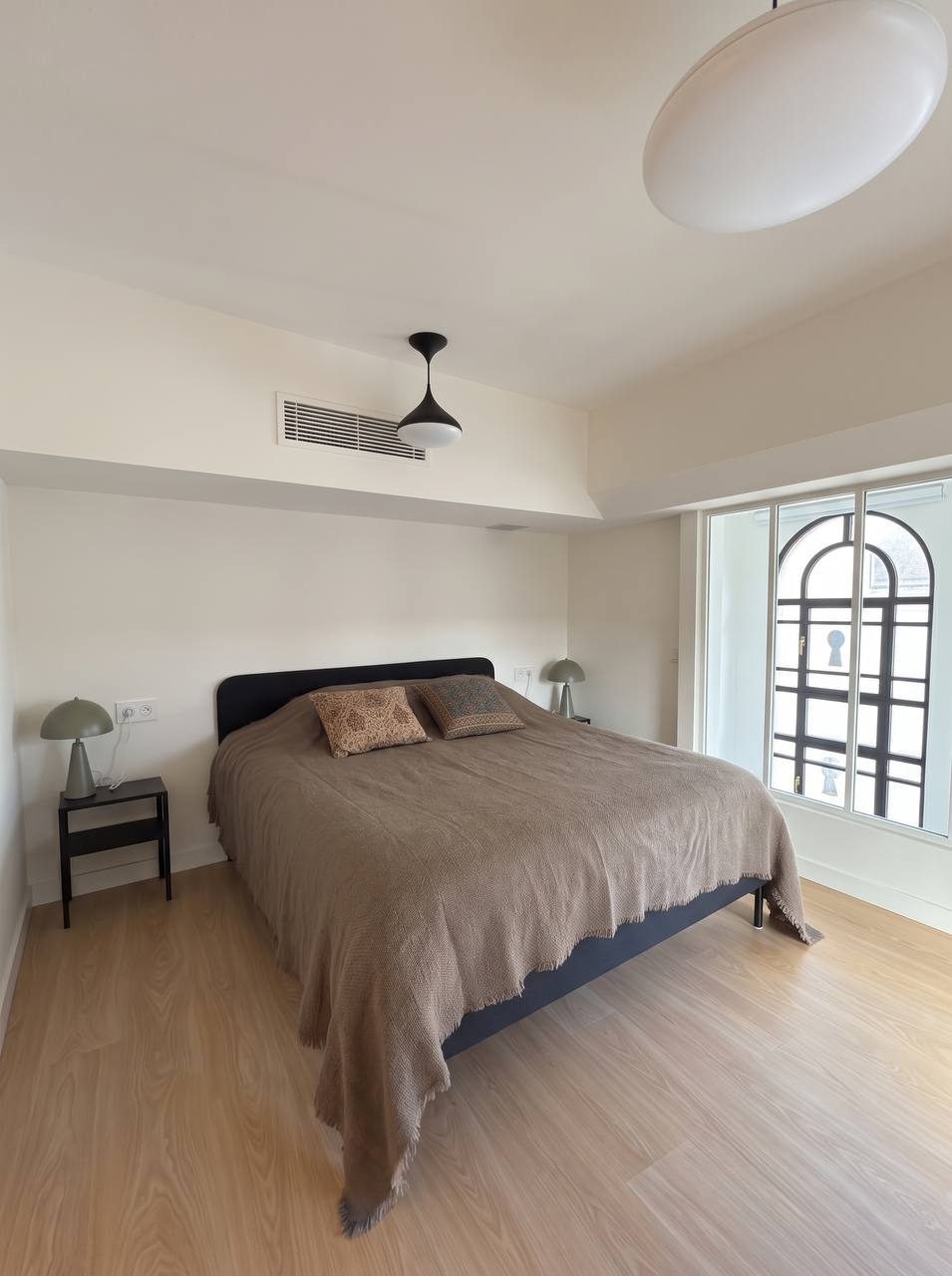 Bedroom with an arched window